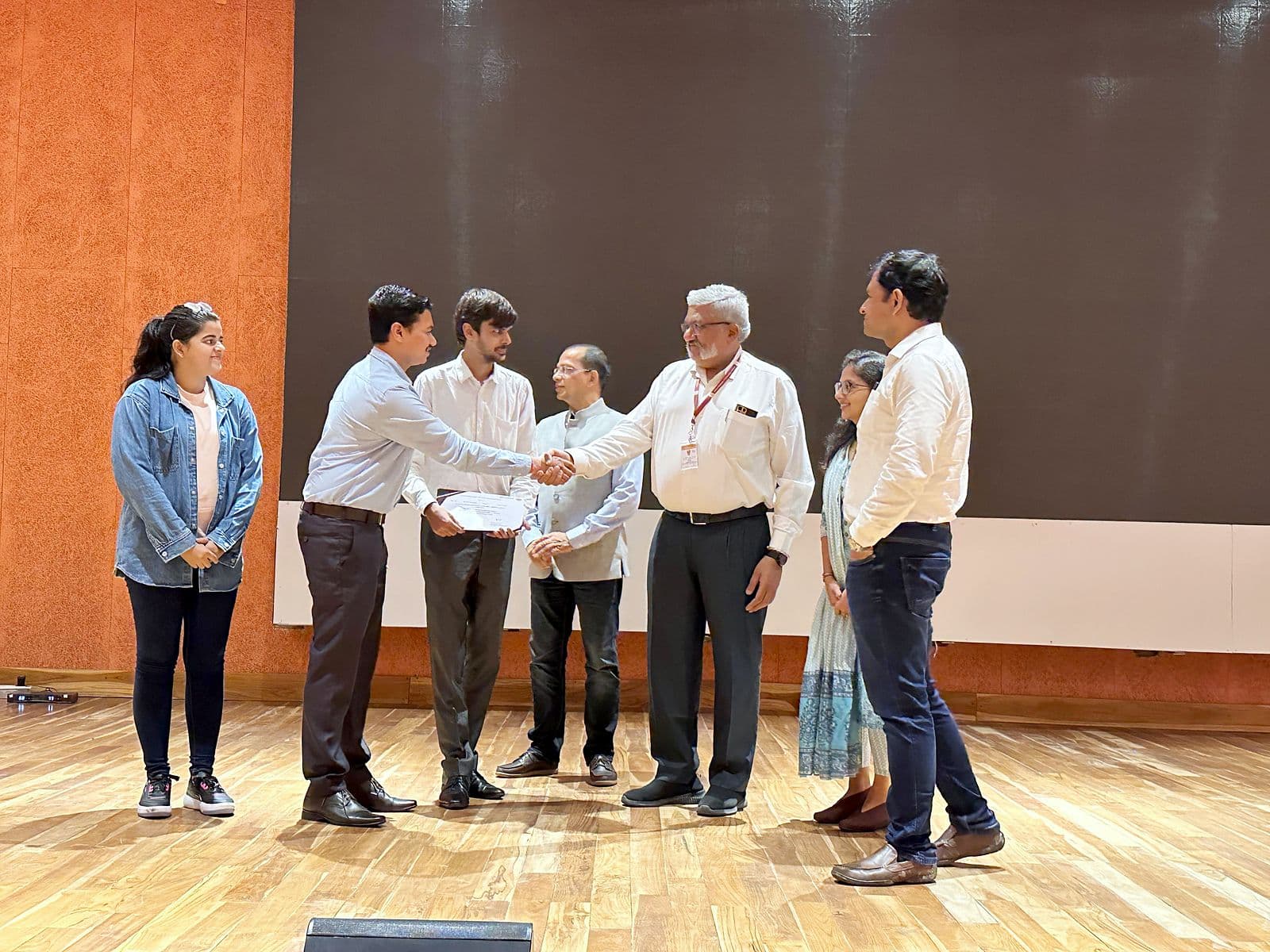 Certificates being presented on stage