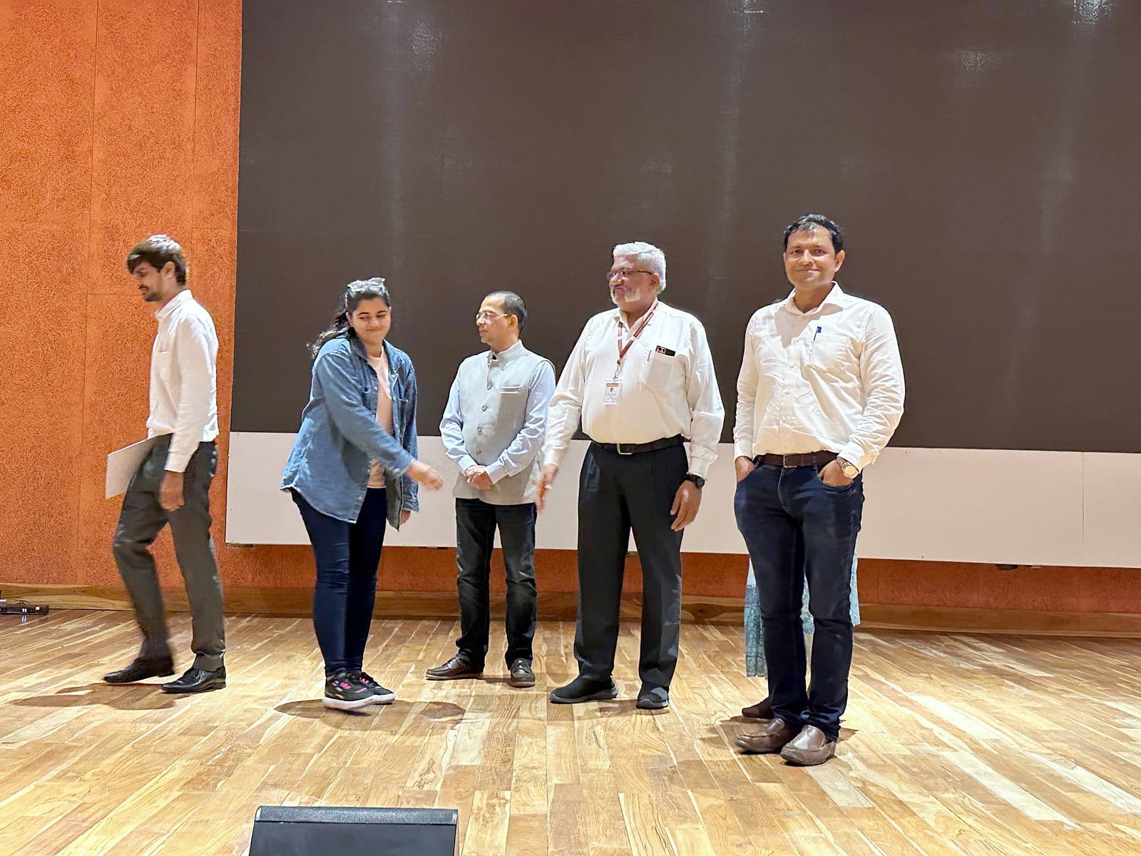 Certificates being presented on stage