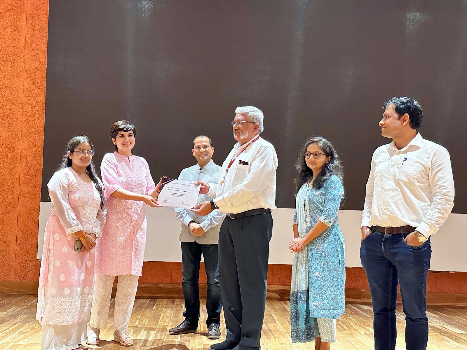 Certificates being presented on stage