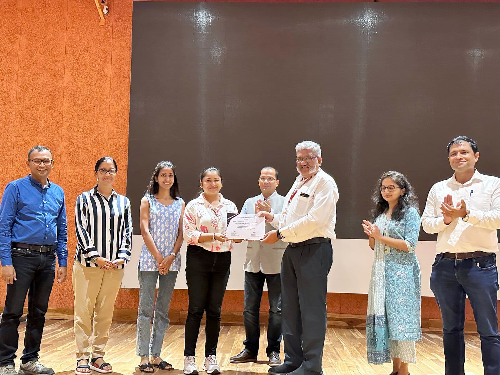 Certificates being presented on stage