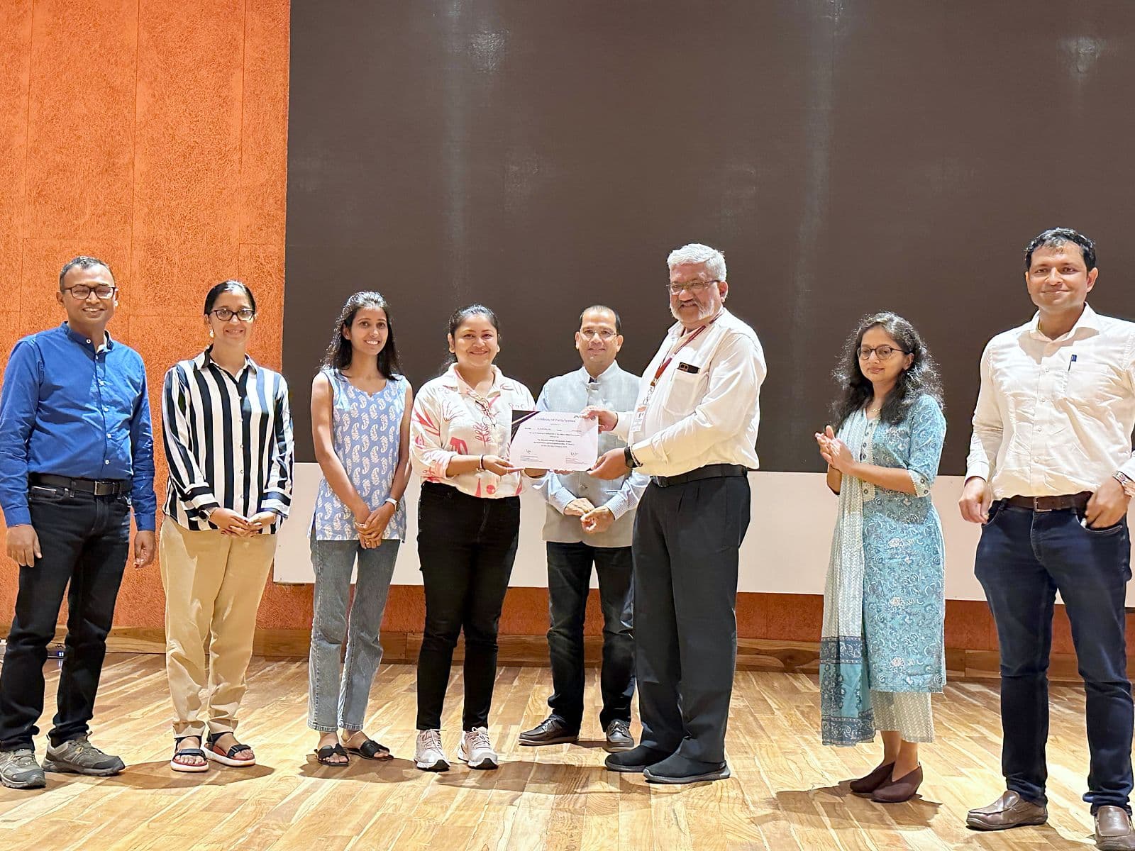 Certificates being presented on stage