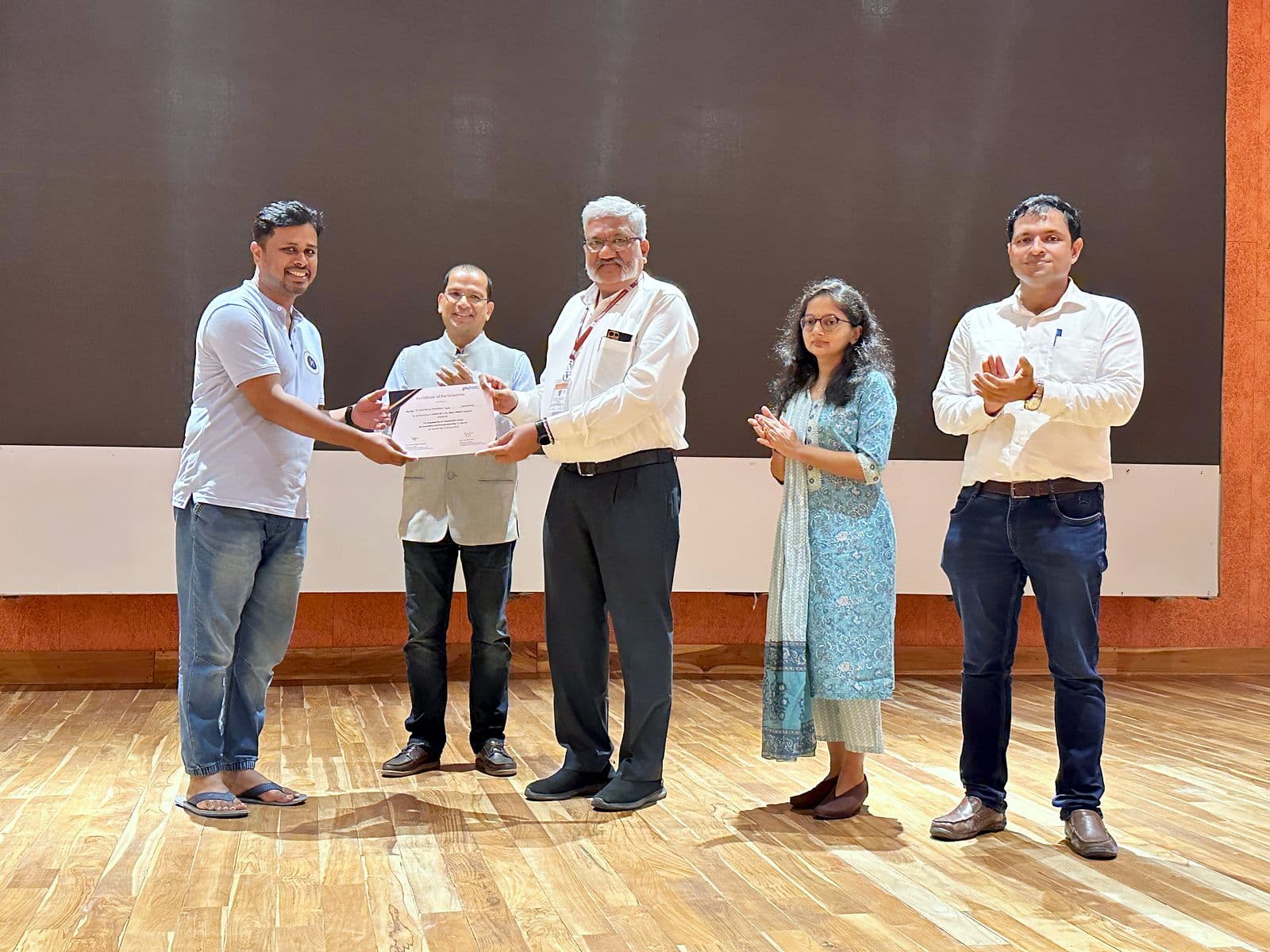 Certificates being presented on stage
