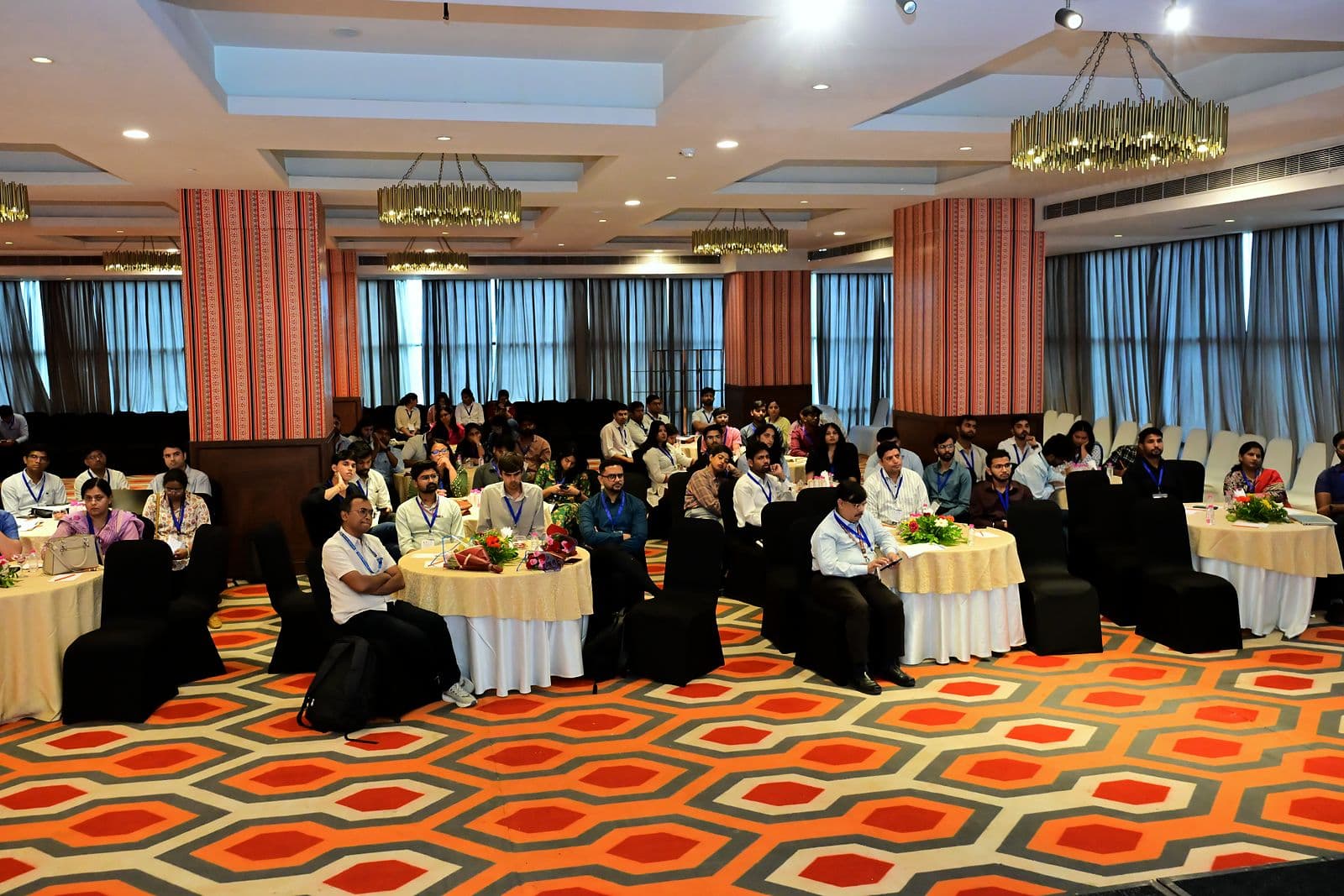 Audience seated at tables in an event hall