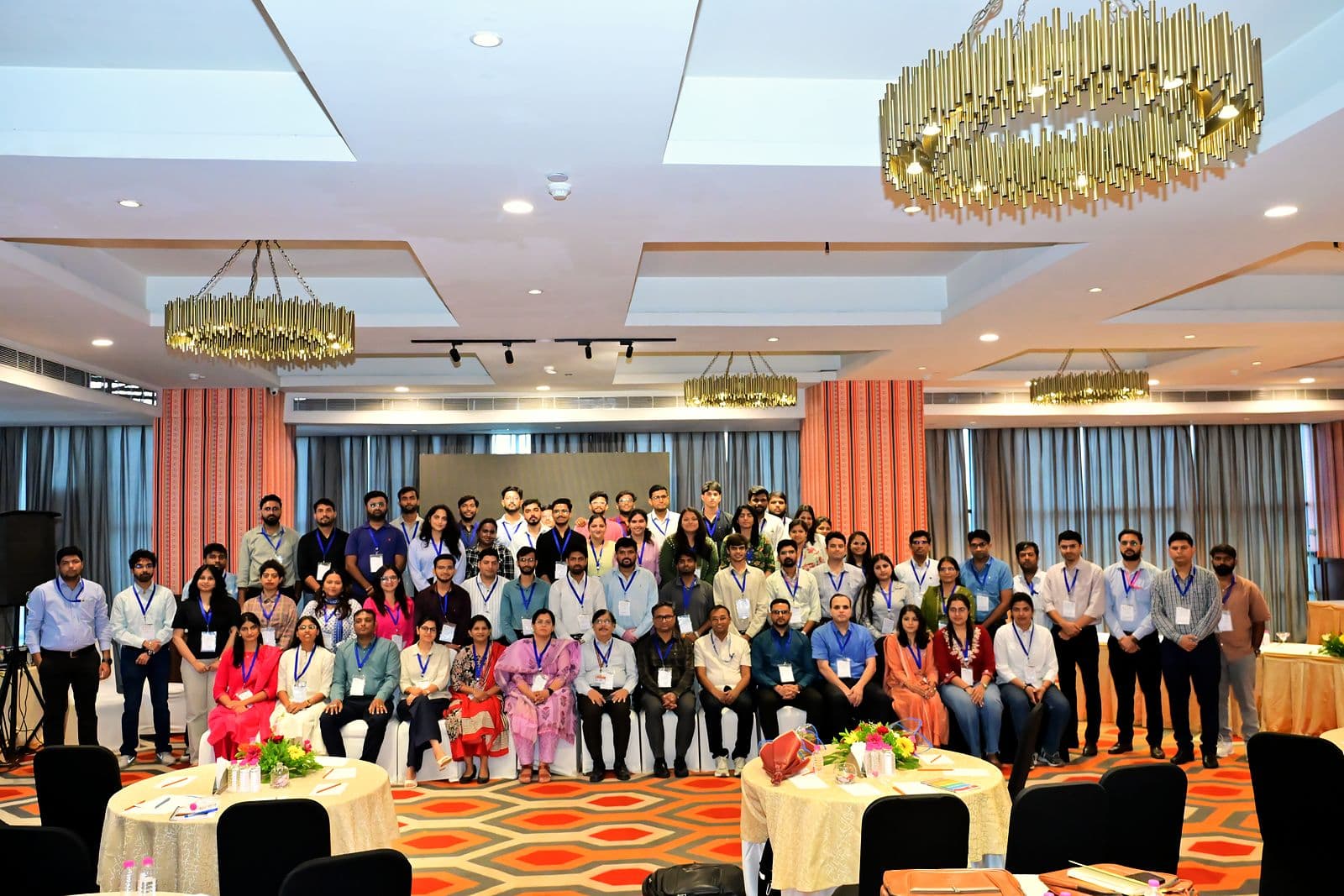 Audience seated at tables in an event hall