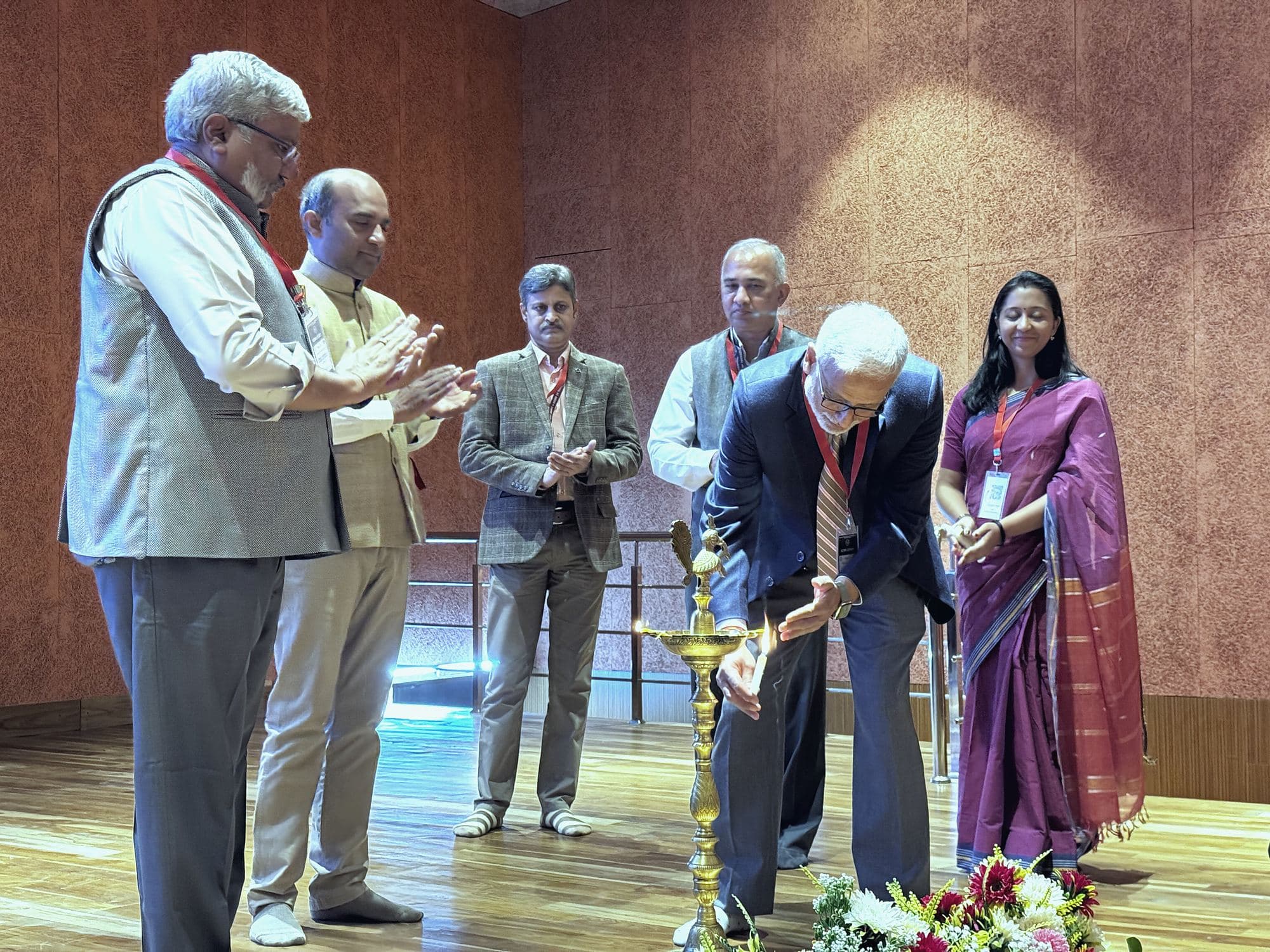 Guests lighting the ceremonial lamp at the opening of the conference