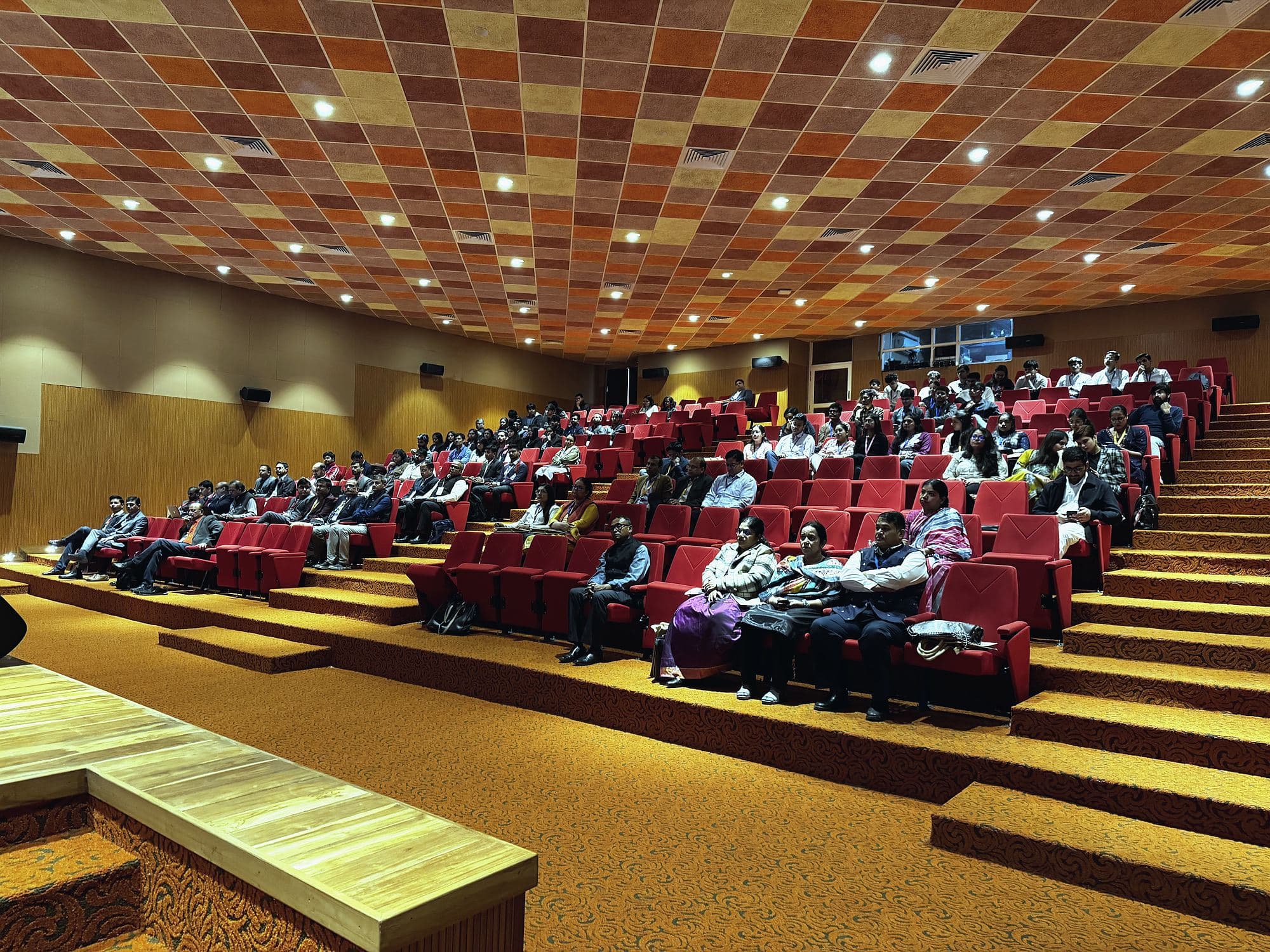 Delegates seated across the raked auditorium
